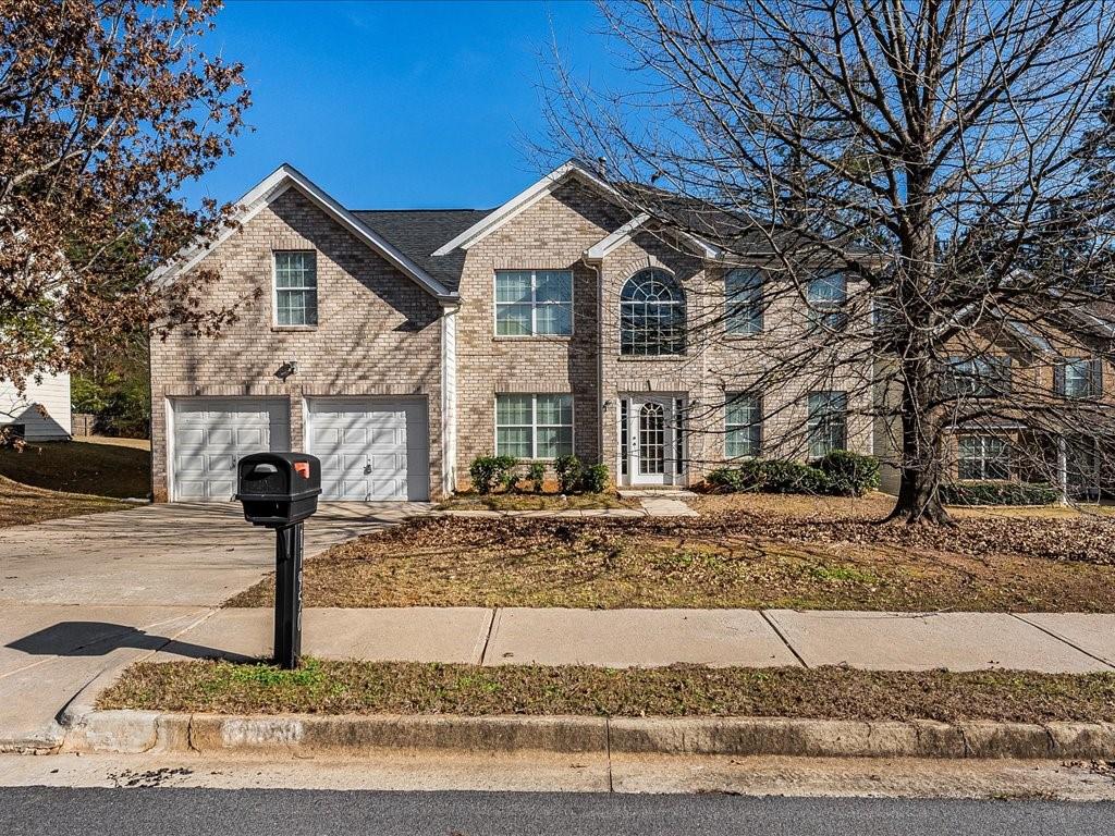11950 Markham Way Hampton, GA 30228 - Photo 2 of 32 a front view of a house with garden