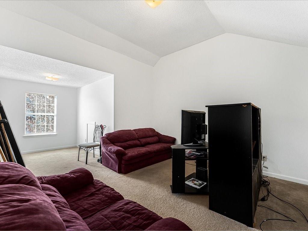 11950 Markham Way Hampton, GA 30228 - Photo 25 of 32 a living room with furniture and a flat screen tv