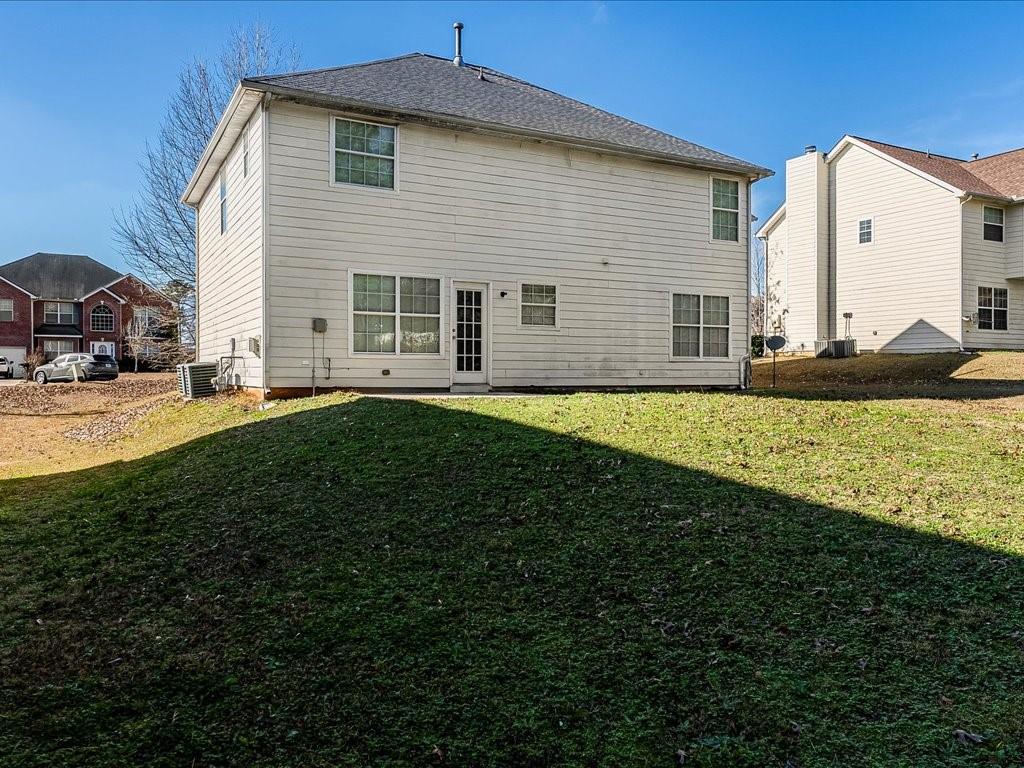 11950 Markham Way Hampton, GA 30228 - Photo 26 of 32 a front view of a house with a yard