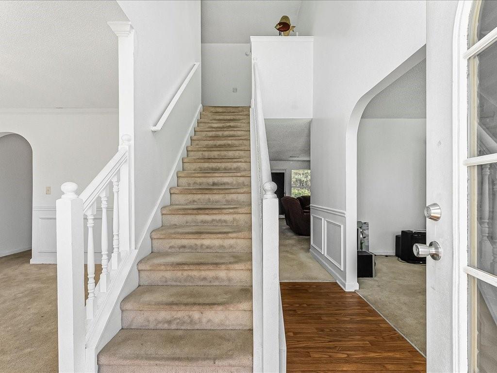11950 Markham Way Hampton, GA 30228 - Photo 5 of 32 a view of a hallway with wooden floor and entryway