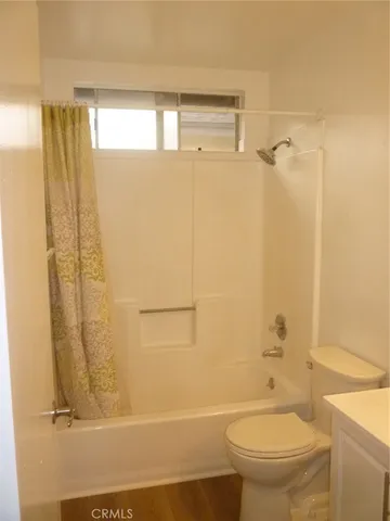 a bathroom with a toilet sink and a shower