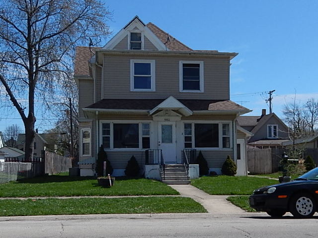 560 South 5th Avenue Kankakee, IL 60901 - Photo 2 of 3 a front view of a house with a garden
