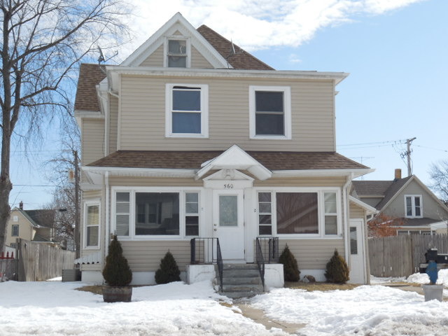 560 South 5th Avenue Kankakee, IL 60901 - Photo 3 of 3 a front view of a house with a yard covered in snow