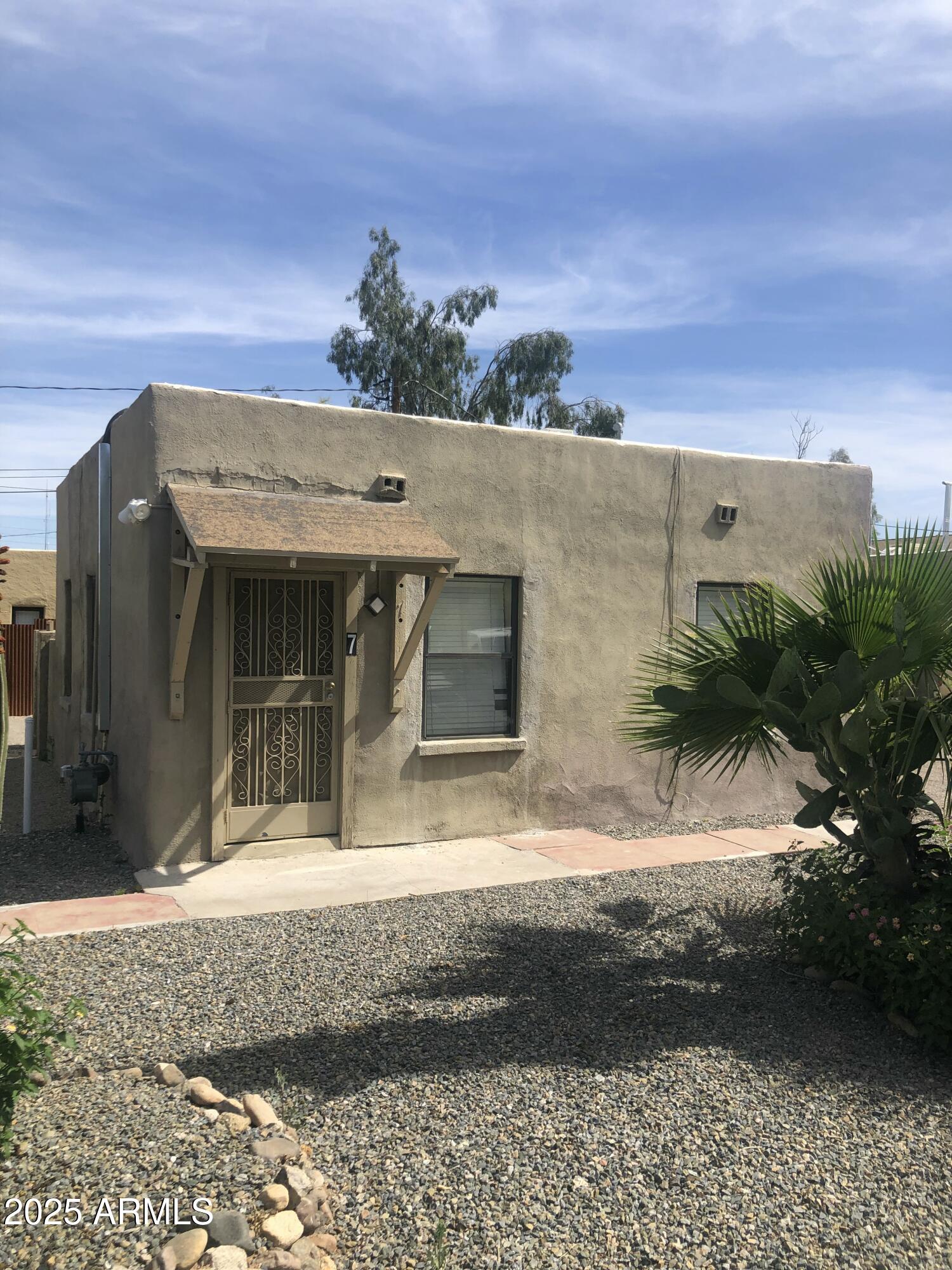 2620 North Stone Avenue Tucson, AZ 85705 - Photo 2 of 12 a view of a house with a yard