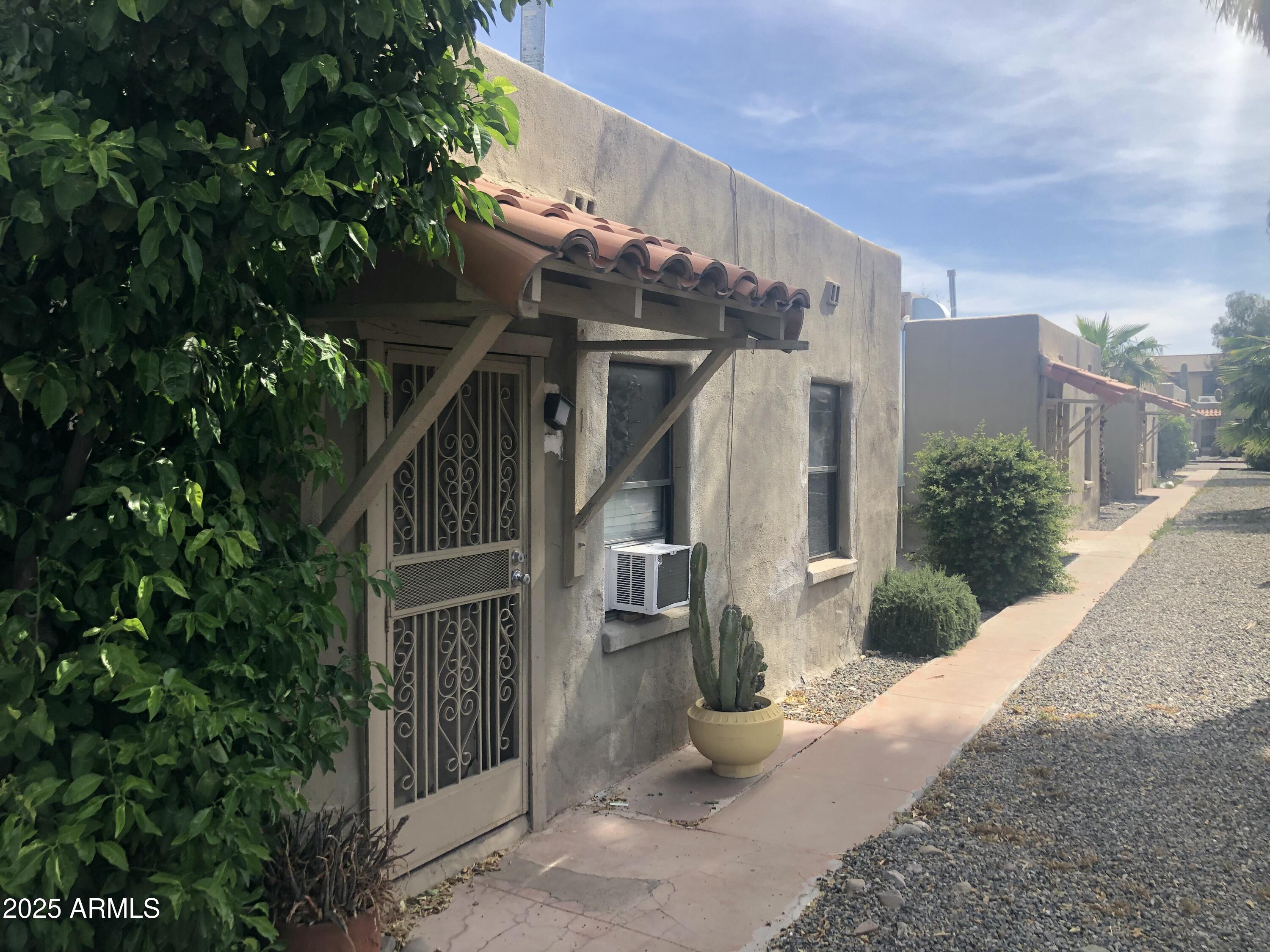 2620 North Stone Avenue Tucson, AZ 85705 - Photo 5 of 12 a front view of a house with a yard