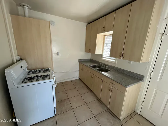 a kitchen with a stove and a microwave