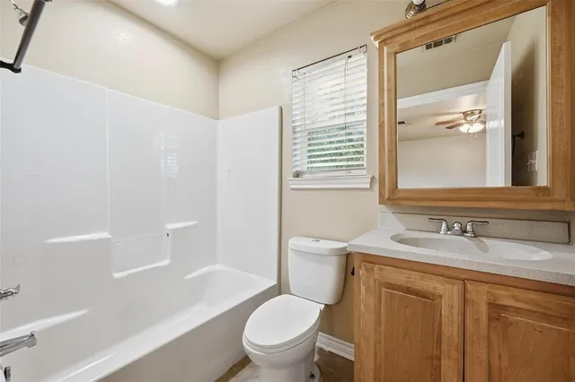 a bathroom with a sink a toilet and a bathtub