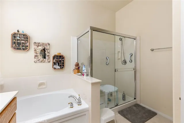 a bathroom with a bathtub and shower