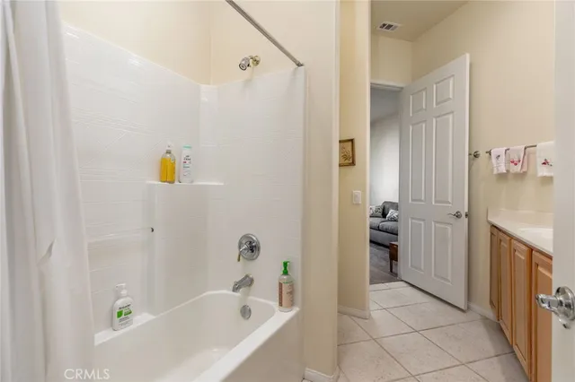 a bathroom with a bathtub and a sink