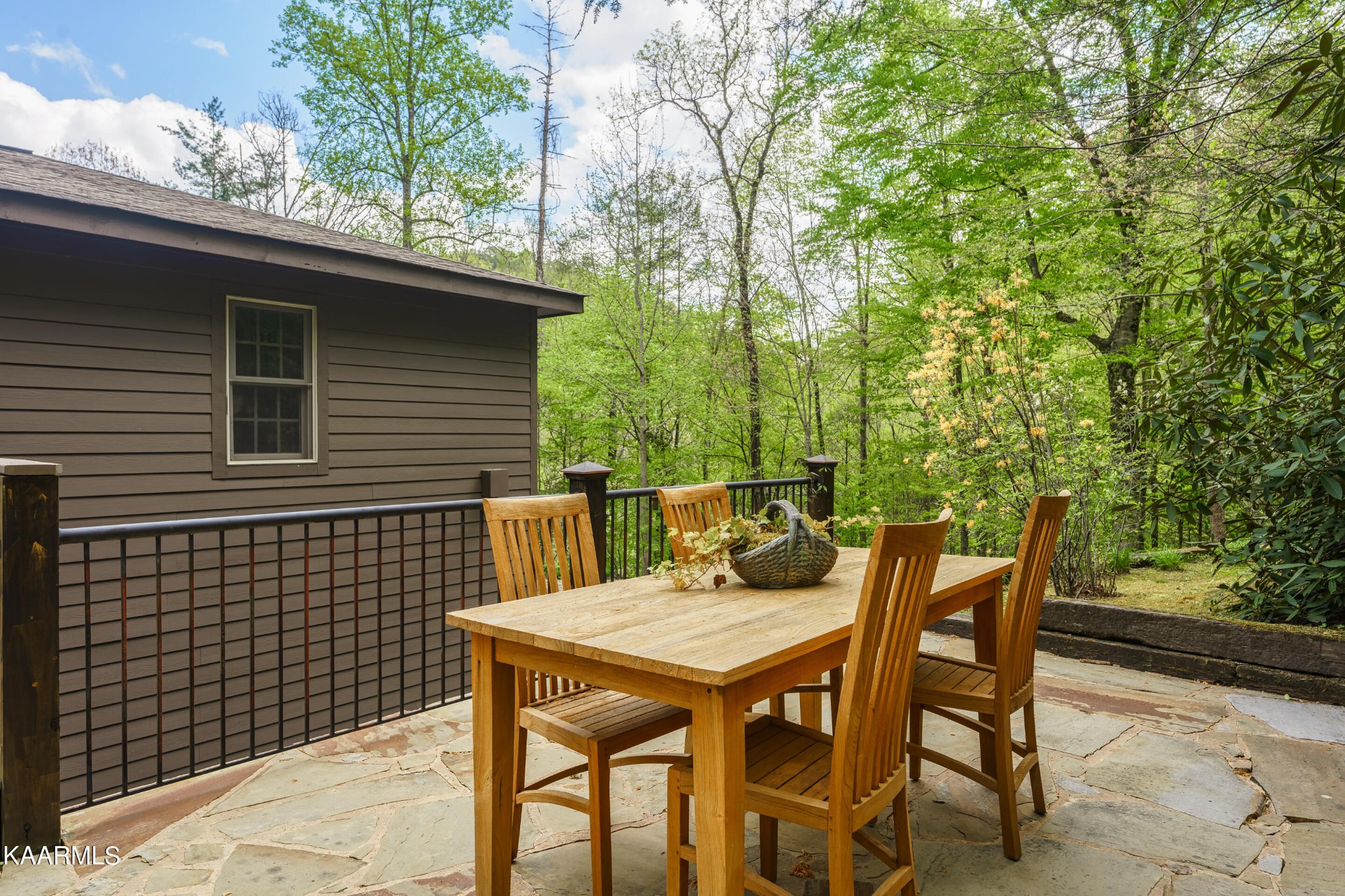4614 Whetstone Road Sevierville, TN 37862 - Photo 38 of 60 a backyard of a house with table and chairs