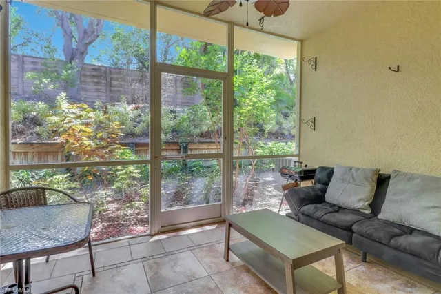 a living room with a couch and a table
