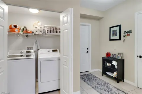 a view of storage and utility room with washer and dryer
