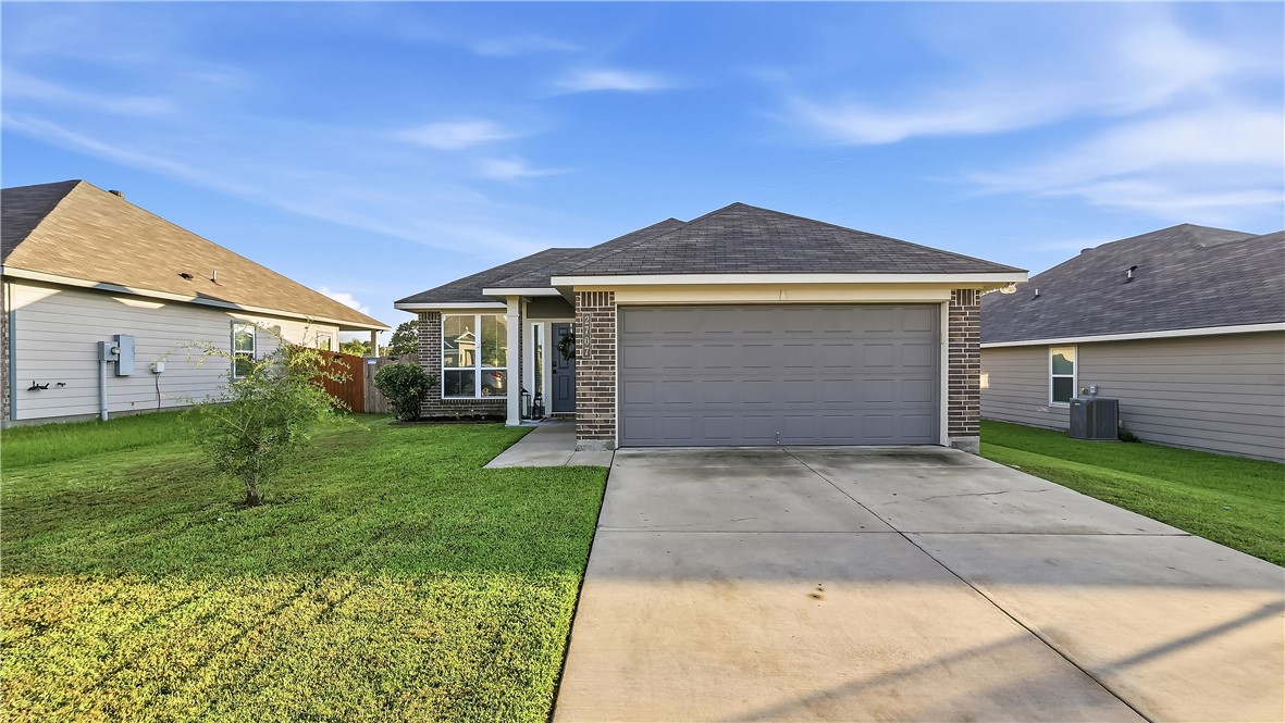 2707 Redcap Street Bryan, TX 77803 - Photo 1 of 28 Single-story residence featuring a two-car garage, brick facade accents, and a concrete driveway