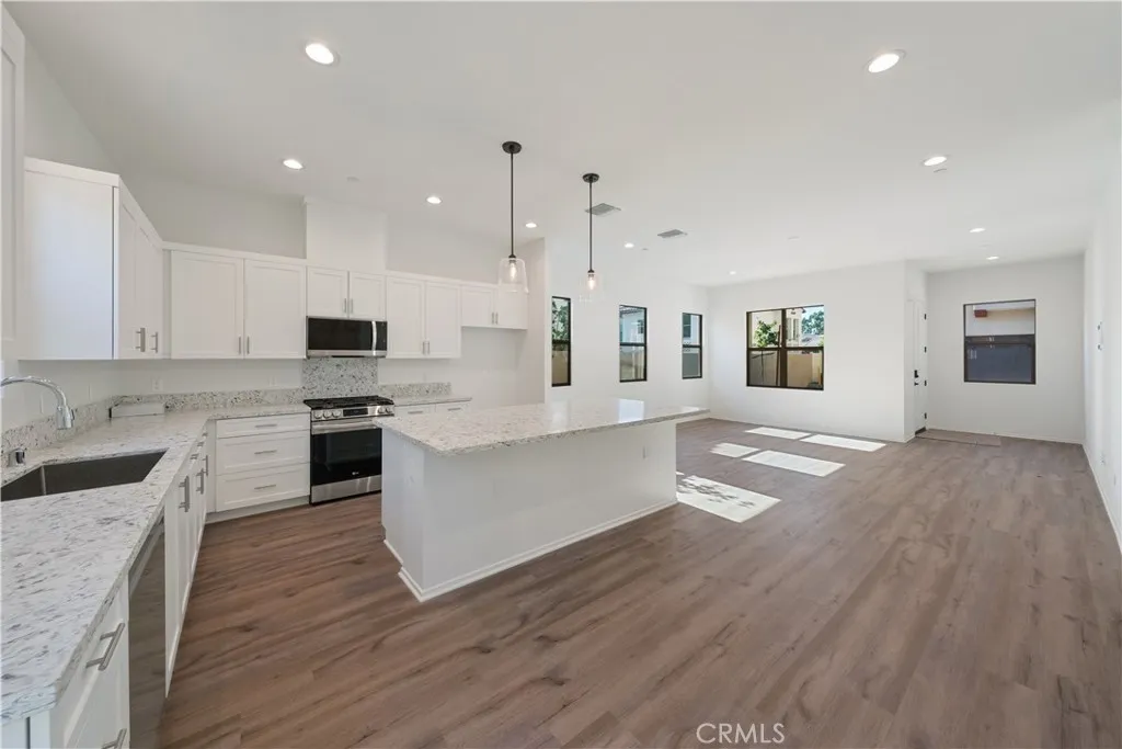 810 Francesca Drive Walnut, CA 91789 - Photo 23 of 33 a large kitchen with stainless steel appliances granite countertop a stove a sink dishwasher and a oven with white cabinets