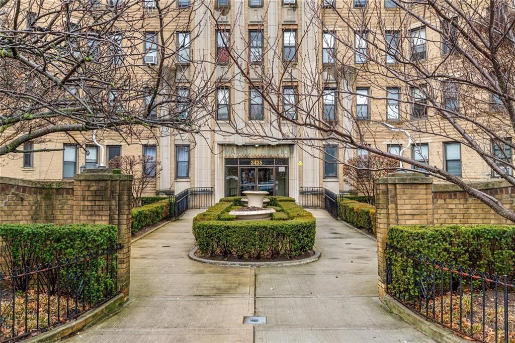 2425 Kings Highway, Unit E16 Brooklyn, NY 11229 - Photo 2 of 11 a front view of a house with garden