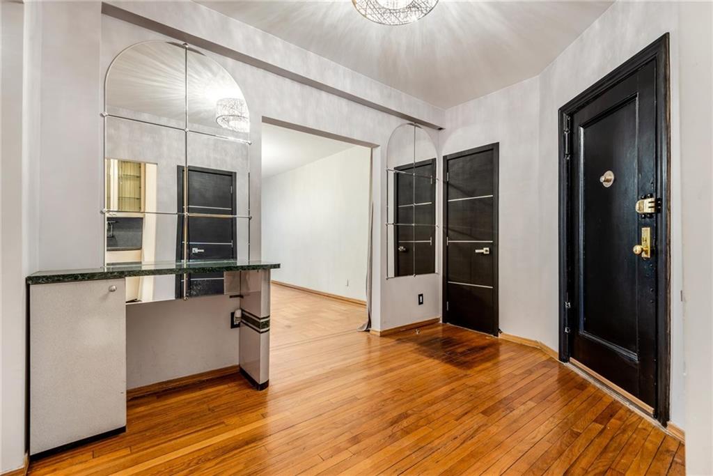 2425 Kings Highway, Unit E16 Brooklyn, NY 11229 - Photo 3 of 11 a living room with furniture window and wooden floor
