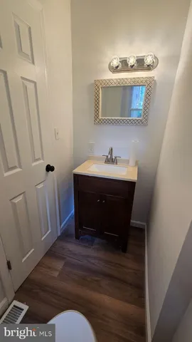 a bathroom with a sink and mirror