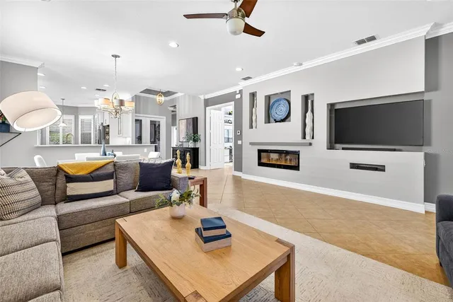a bedroom with furniture and a flat screen tv