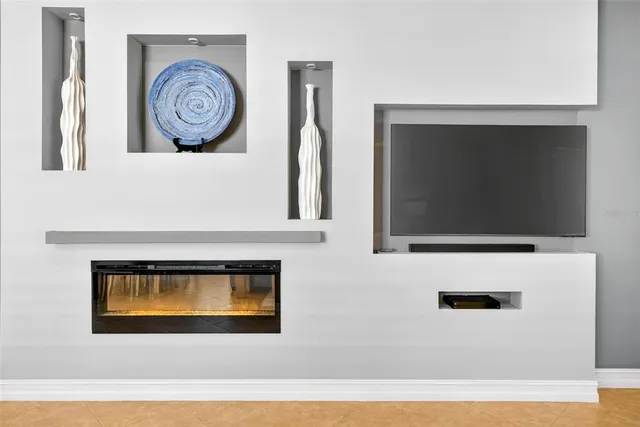 a bathroom with a granite countertop sink mirror vanity bathtub and a toilet