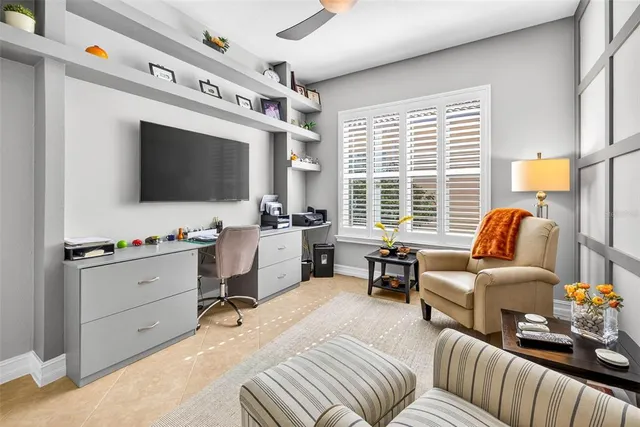 a bedroom with a bed and large window