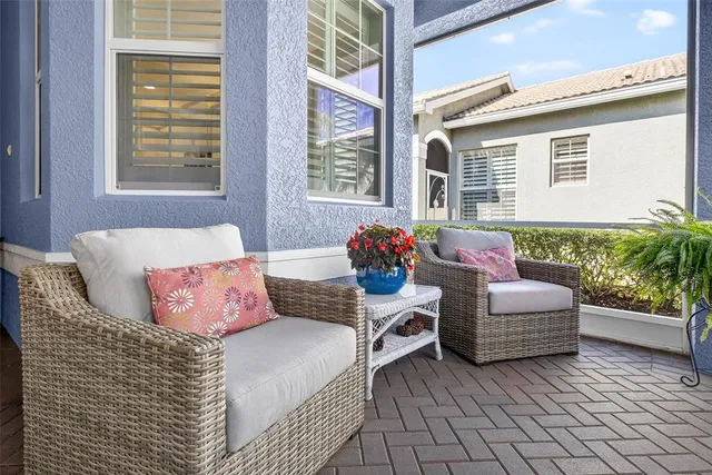 a view of a hallway with wooden floor and a livingroom