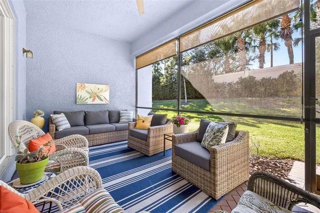 an aerial view of a resort with swimming pool and outdoor seating