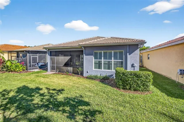 a view of swimming pool with a patio and a garden