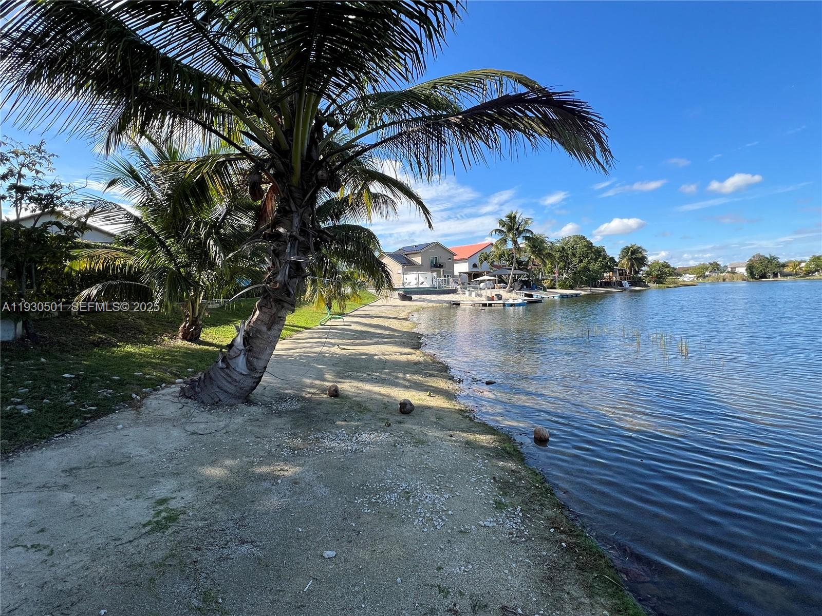 6101 Southwest 153rd Court Road Miami, FL 33193 - Photo 20 of 49 a view of a lake with a yard