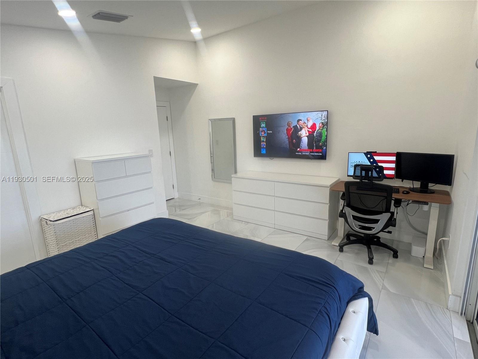 6101 Southwest 153rd Court Road Miami, FL 33193 - Photo 35 of 49 a bedroom with a bed and furniture