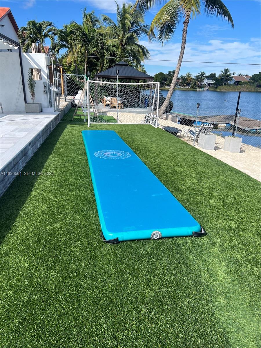 6101 Southwest 153rd Court Road Miami, FL 33193 - Photo 6 of 49 a view of a swimming pool with a patio