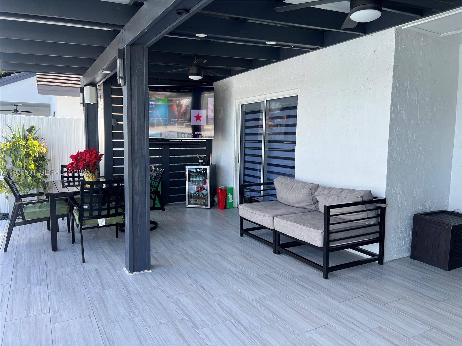 6101 Southwest 153rd Court Road Miami, FL 33193 - Photo 7 of 49 a view of a livingroom with furniture and a flat screen tv