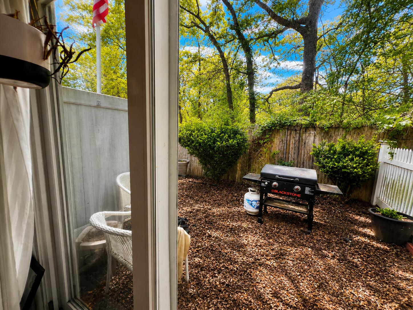 63 Security Street, Unit 1 Hyannis, MA 02601 - Photo 8 of 8 a view of a bench in a backyard