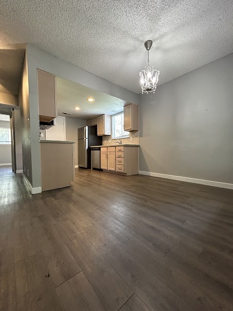 3436 Willowrun Drive, Unit D Austin, TX 78704 - Photo 9 of 9 a view of a kitchen with a sink a refrigerator and window