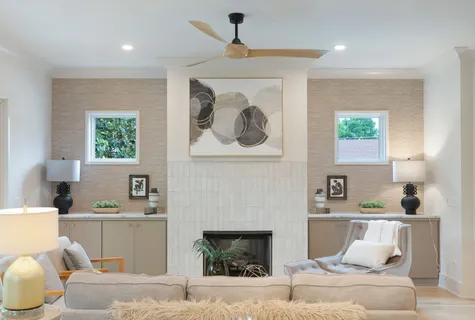 a kitchen with kitchen island a dining table and a chandelier