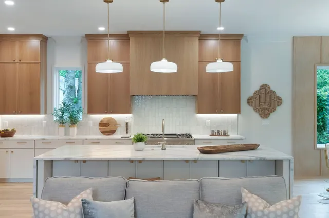 a bedroom with a bed and large window