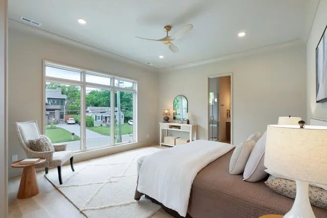 a bedroom with a bed and a table