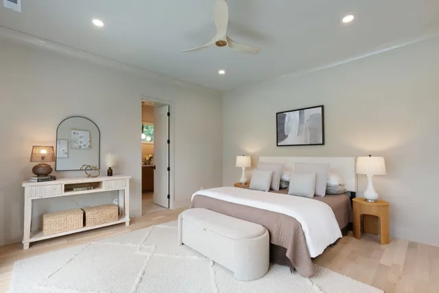 a bedroom with a large bed and a couch