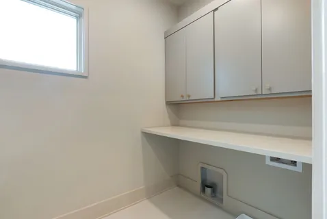 a bathroom with a granite countertop sink a toilet and bathtub