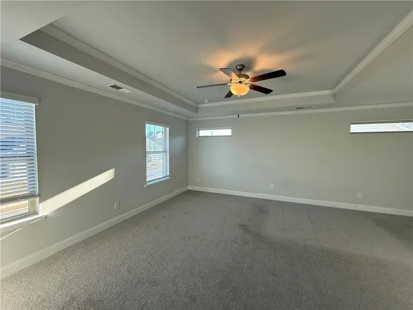 a view of empty room with windows