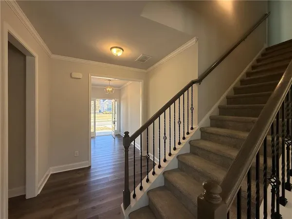 a view of staircase with wooden floor and staircase