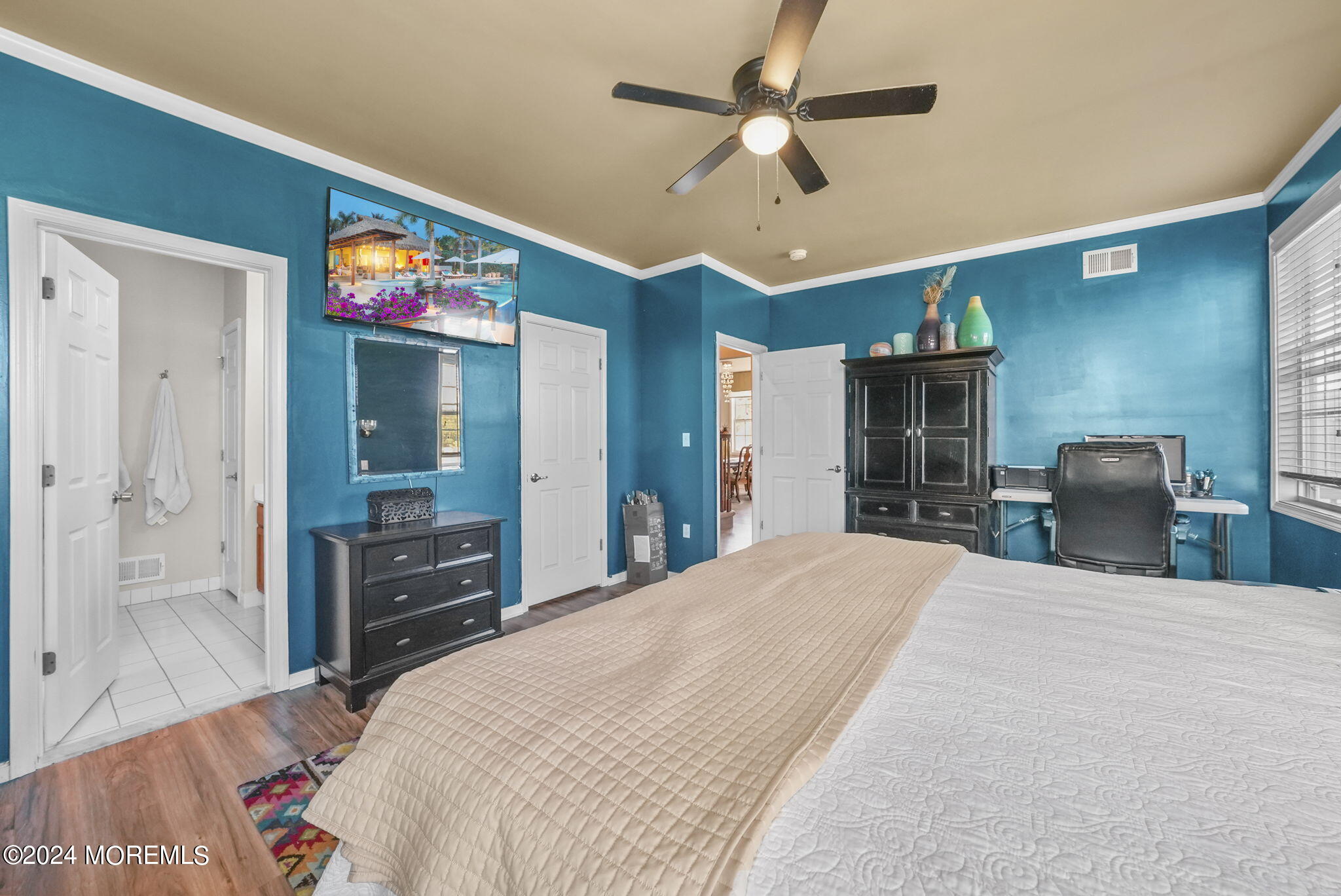 30 Silver Maple Lane Howell, NJ 07731 - Photo 20 of 43 a bedroom with a bed and a chandelier