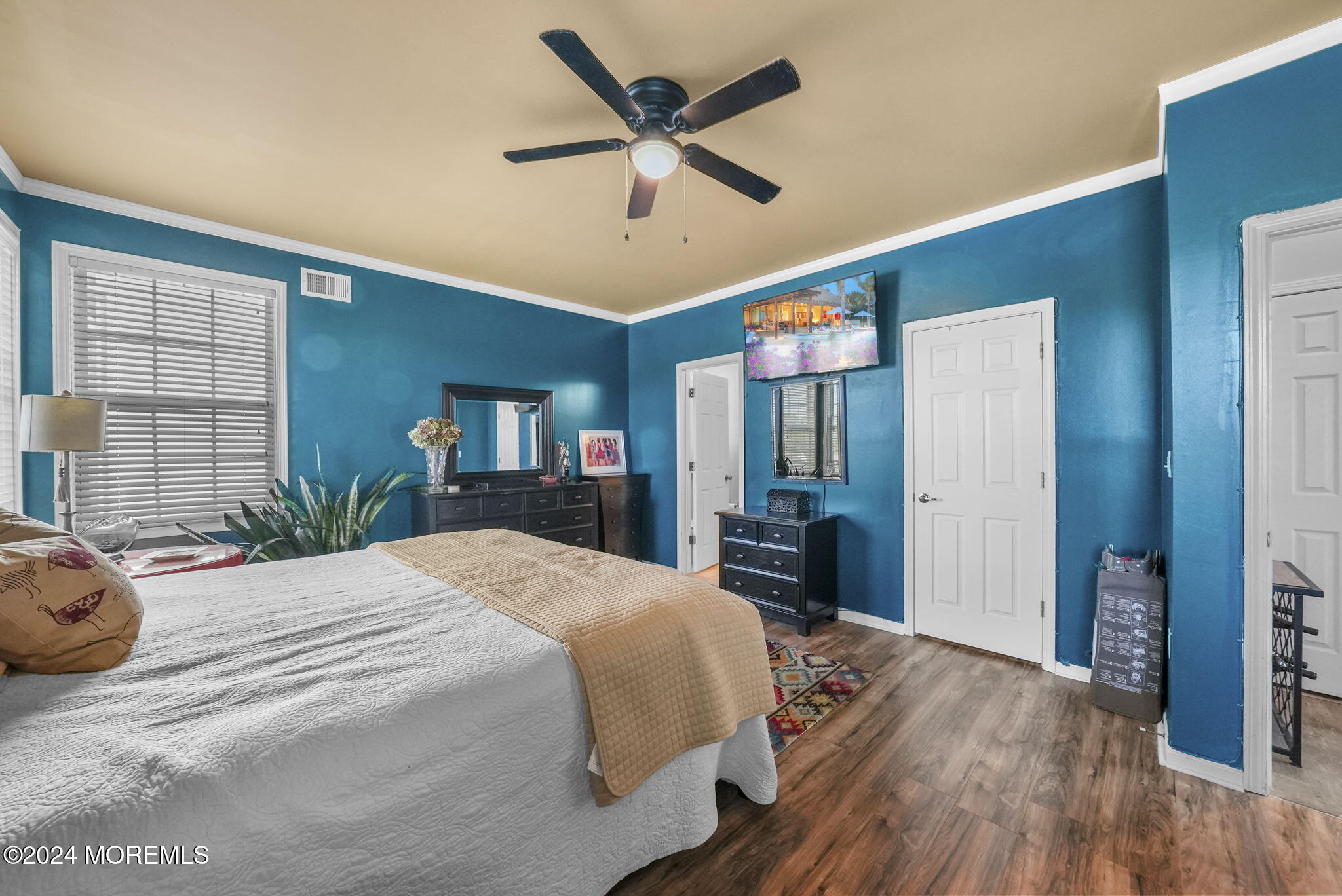 30 Silver Maple Lane Howell, NJ 07731 - Photo 21 of 43 a bedroom with a bed ceiling fan and a wooden floor