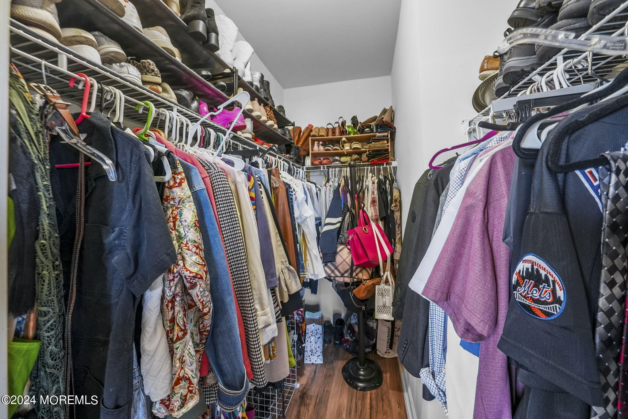30 Silver Maple Lane Howell, NJ 07731 - Photo 22 of 43 a view of walk in closet with clothes