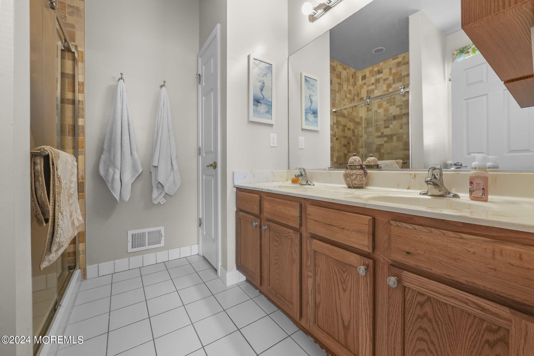 30 Silver Maple Lane Howell, NJ 07731 - Photo 23 of 43 a spacious bathroom with a double vanity sink a mirror a shower and a bathtub