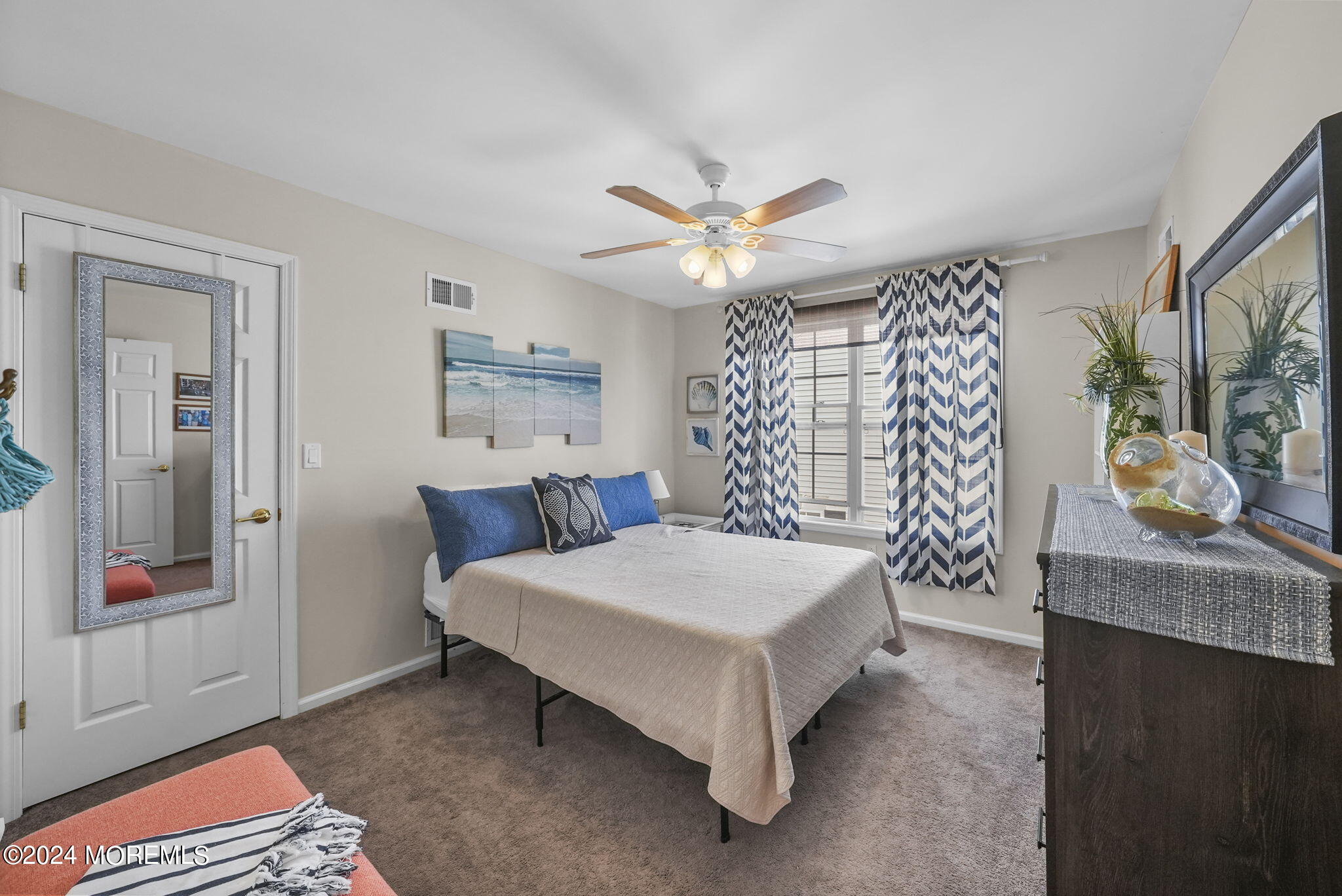 30 Silver Maple Lane Howell, NJ 07731 - Photo 28 of 43 a spacious bedroom with a bed and a chandelier