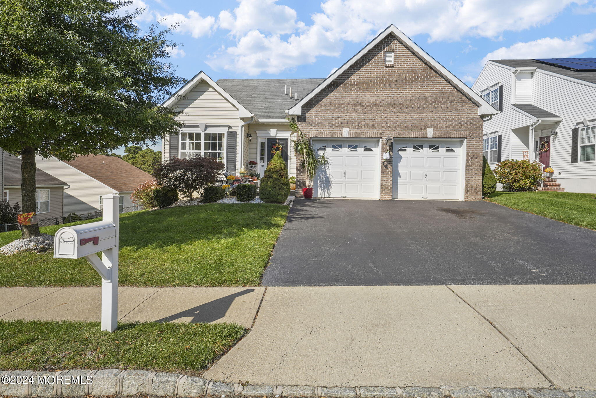 30 Silver Maple Lane Howell, NJ 07731 - Photo 37 of 43 a front view of a house with a yard and garage