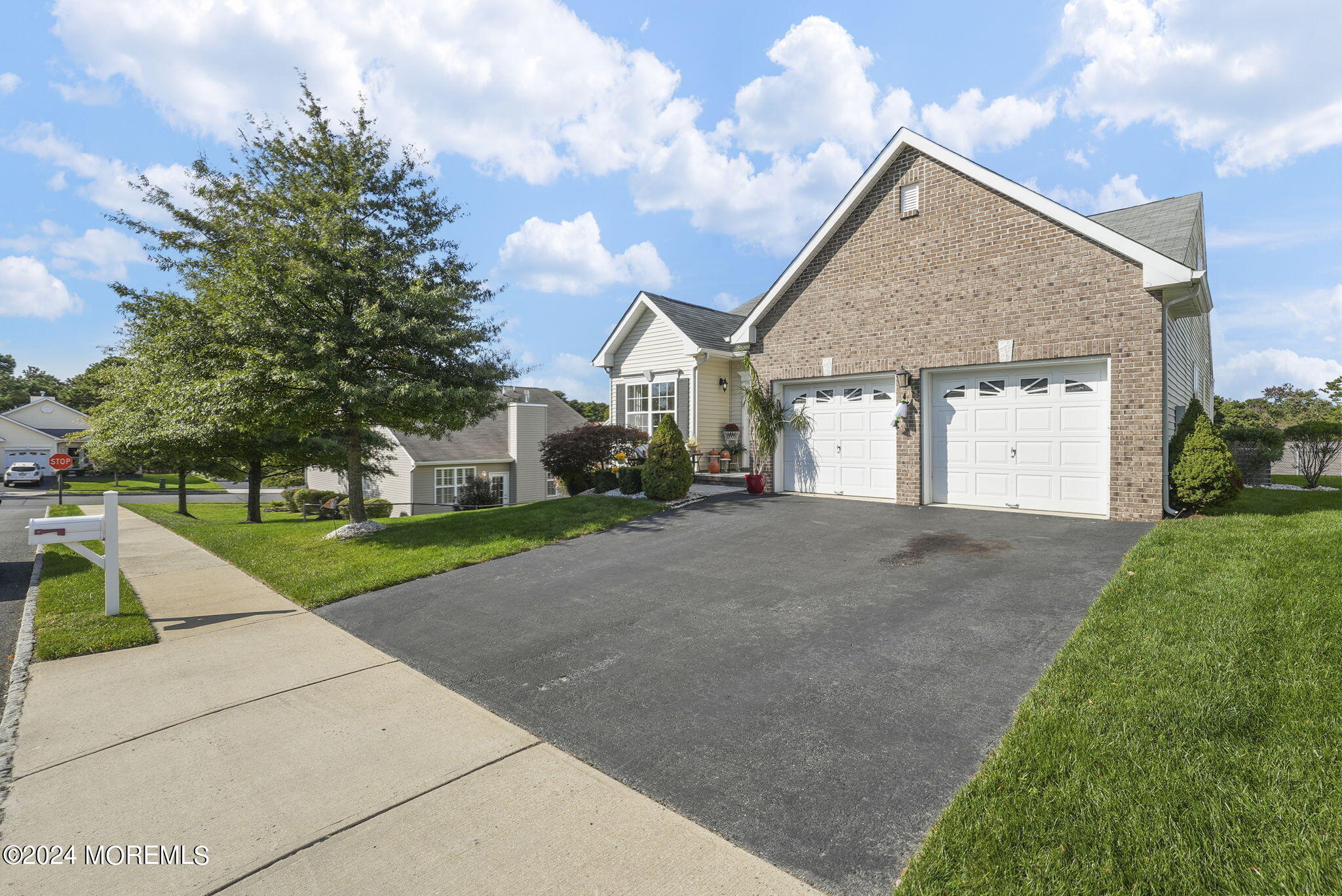 30 Silver Maple Lane Howell, NJ 07731 - Photo 38 of 43 a front view of a house with a yard and garage