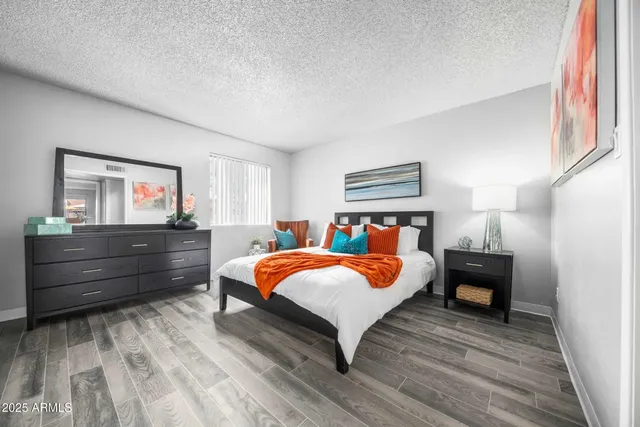 a bedroom with a bed and window