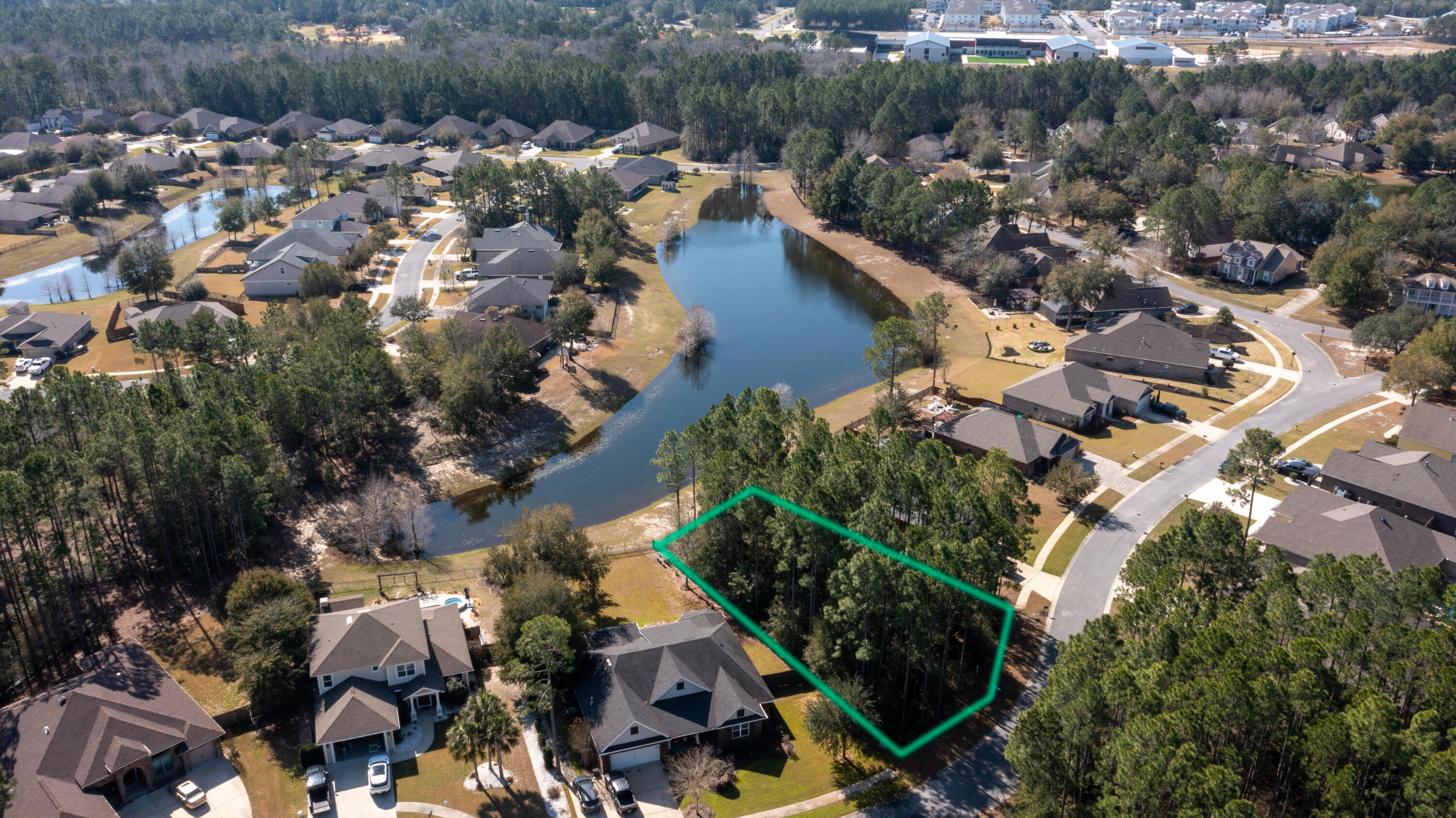Lot 58 Concert Court Freeport, FL 32439 - Photo 3 of 37 an aerial view of a house with a yard and lake view