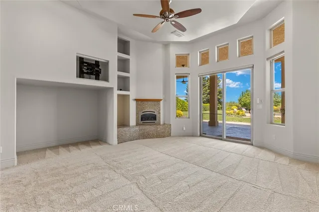 a bathroom with a granite countertop toilet sink and mirror